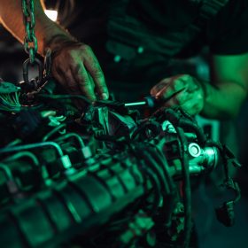 Mechanic working on the detailed parts of a vehicle engine